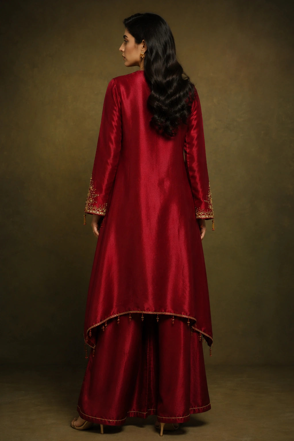 Rouge Celeste by Miraam featuring a ruby crimson asymmetrical sheesha silk shirt with palazzo trousers and an embroidered organza dupatta.