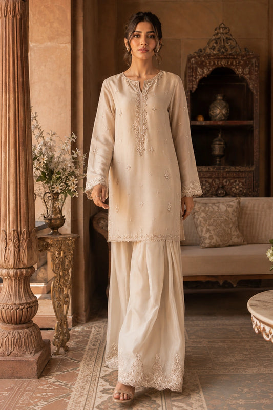 Ivory Étoile luxury ivory Korean silk formal featuring an embroidered straight shirt, Korean silk sharara, and embroidered organza dupatta by Miraam.