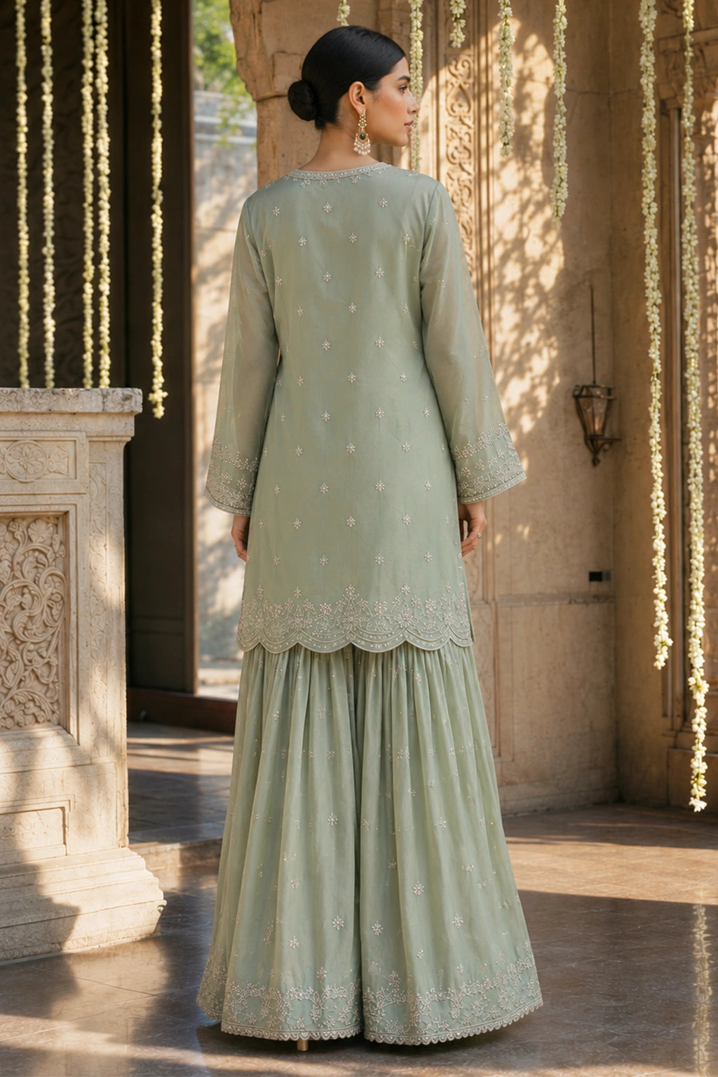 Verdelle Sage luxury sage green Korean silk formal dress featuring embroidered straight shirt, flowing gharara and embroidered organza dupatta by Miraam.
