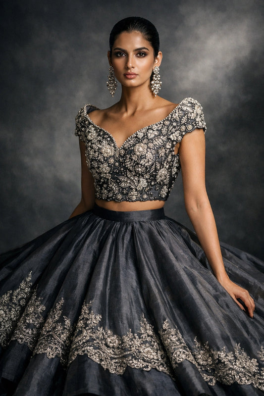 Charcoal formal lehenga with embellished blouse by Miraam, styled in a luxury studio editorial
