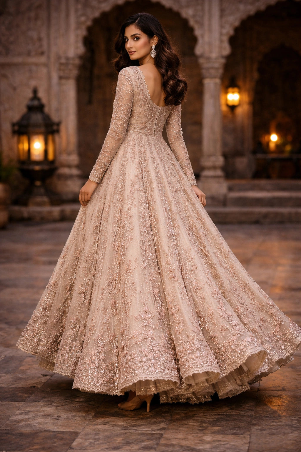Blush formal embellished gown by Miraam with full-length silhouette, styled in a luxury editorial setting