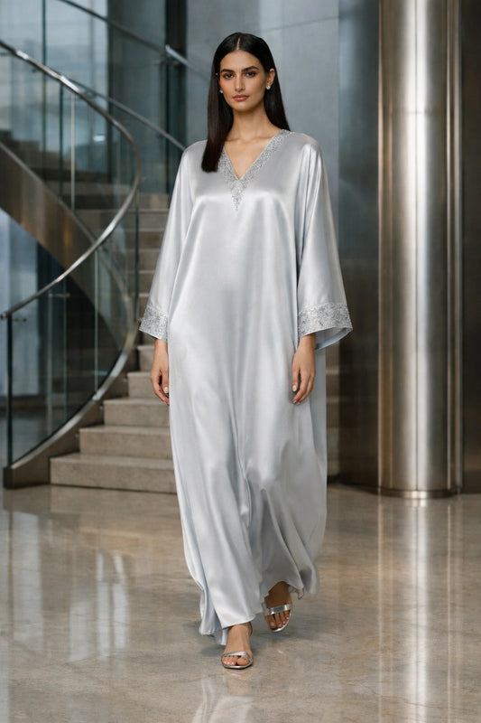 Silver silk kaftan with minimal embellishment, modern Pakistani luxury evening wear