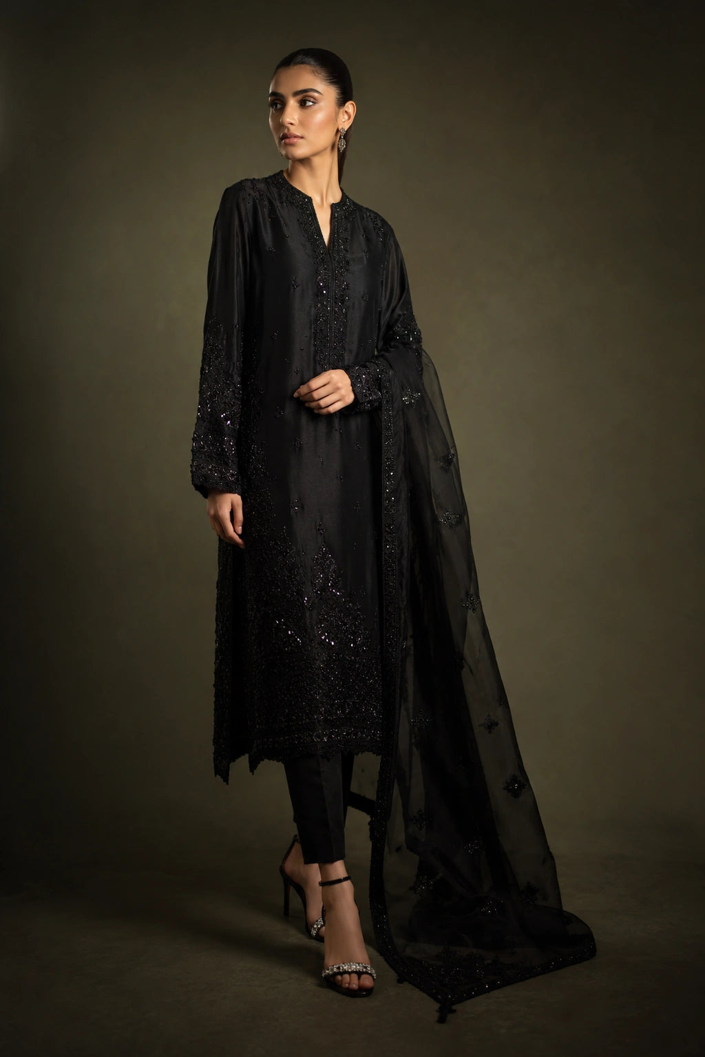 Noir Étoile by Miraam featuring a black sheesha silk embroidered formal with matching trousers and an embroidered organza dupatta.