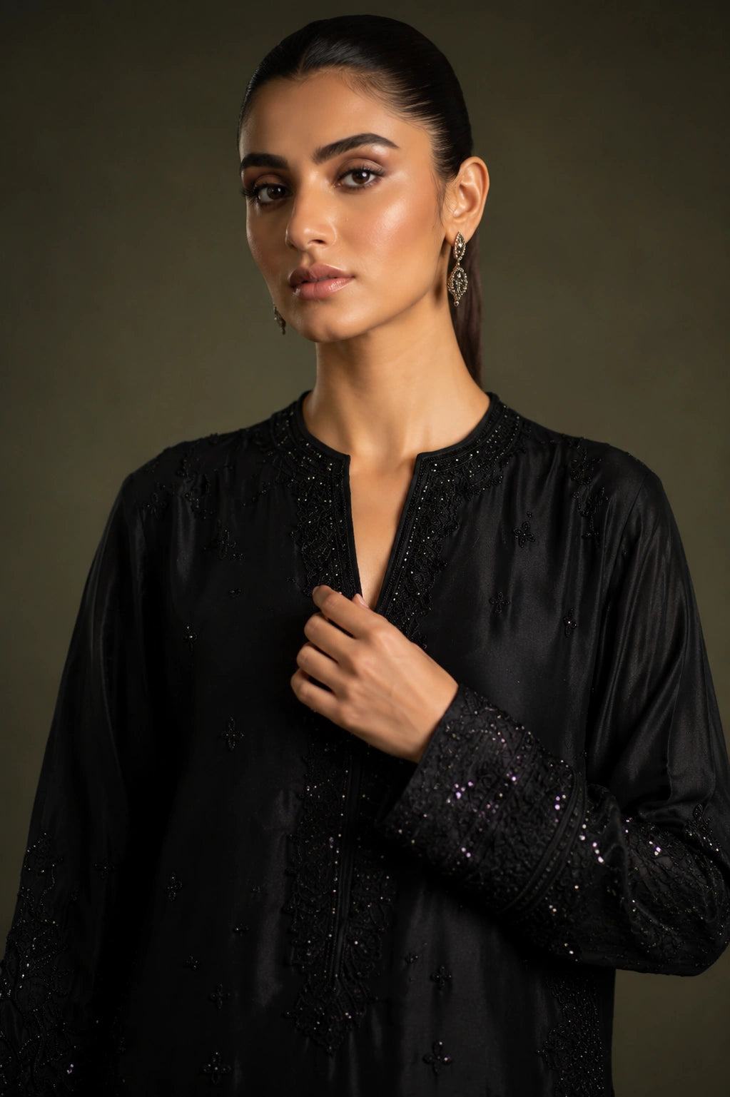 Noir Étoile by Miraam featuring a black sheesha silk embroidered formal with matching trousers and an embroidered organza dupatta.