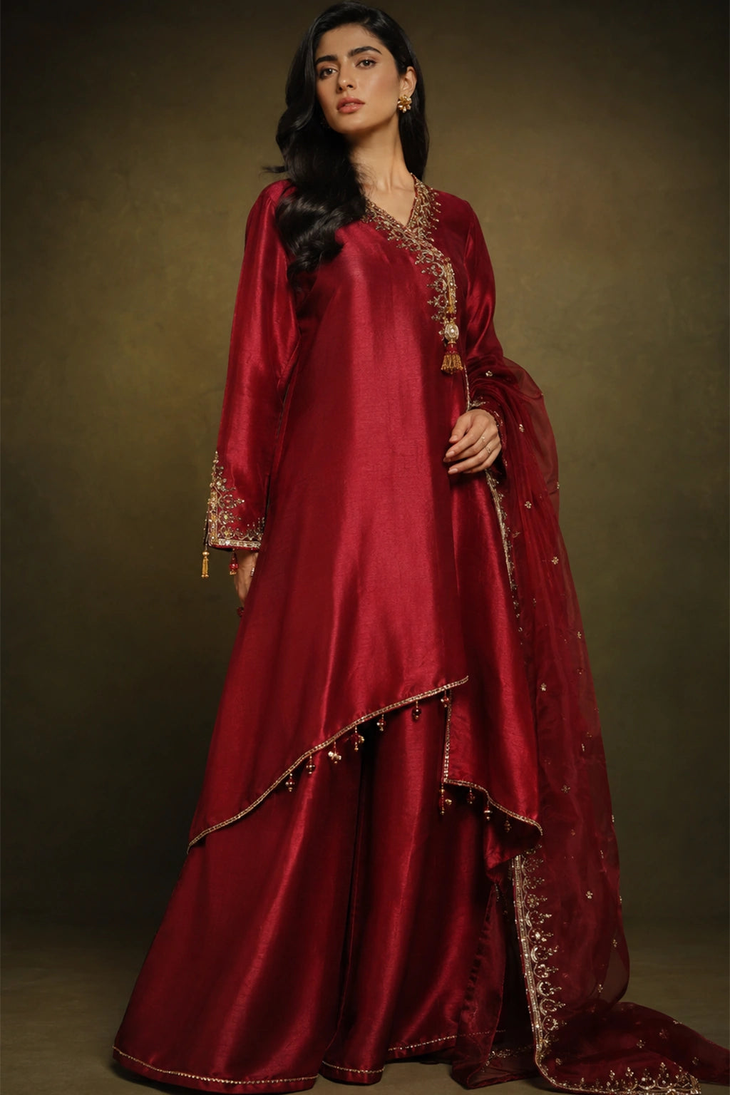 Rouge Celeste by Miraam featuring a ruby crimson asymmetrical sheesha silk shirt with palazzo trousers and an embroidered organza dupatta.