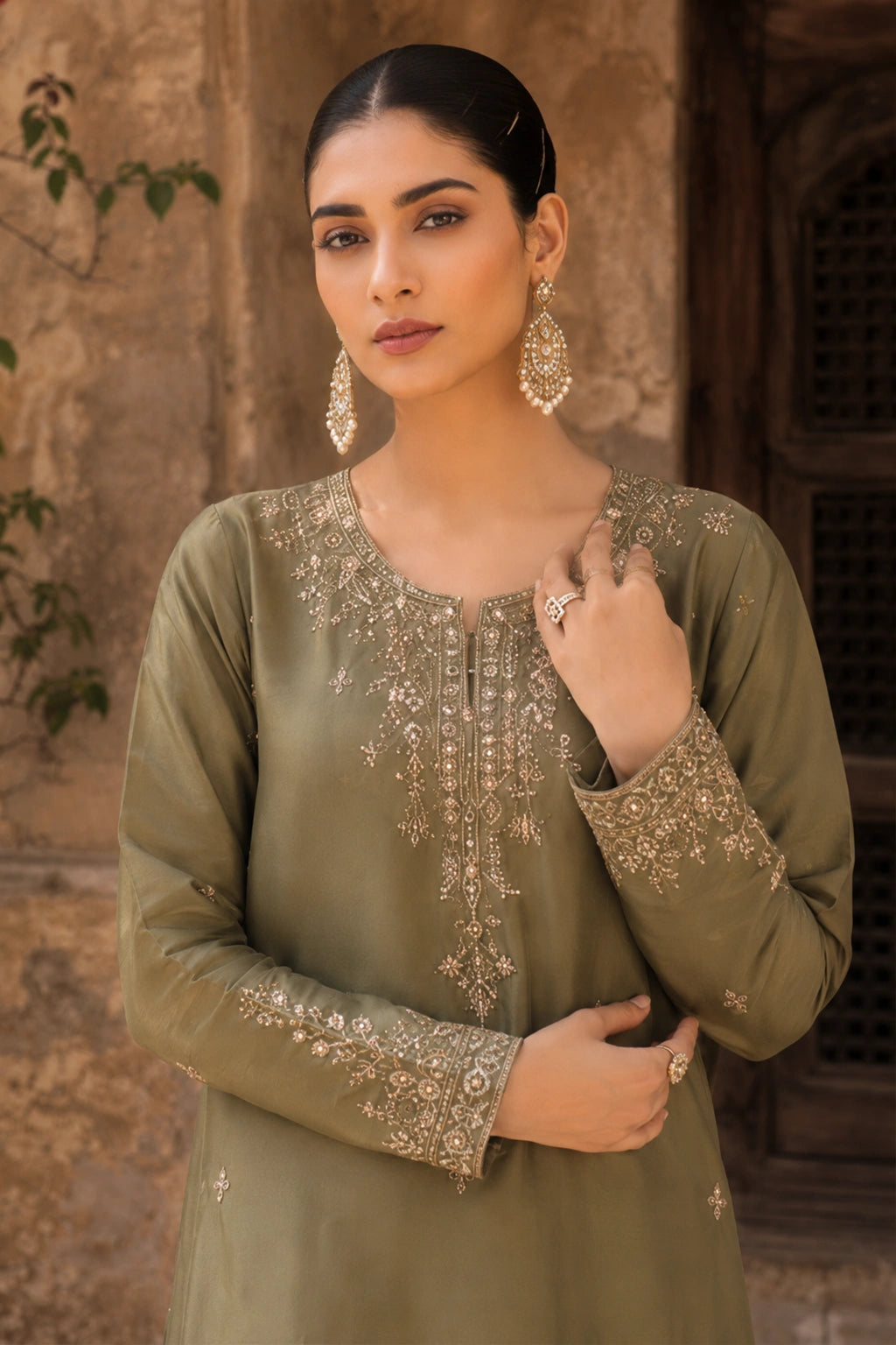 Aurevia Olive luxury olive green Korean silk formal dress featuring an embroidered straight shirt, flowing Korean silk lehenga, and embroidered organza dupatta by Miraam.
