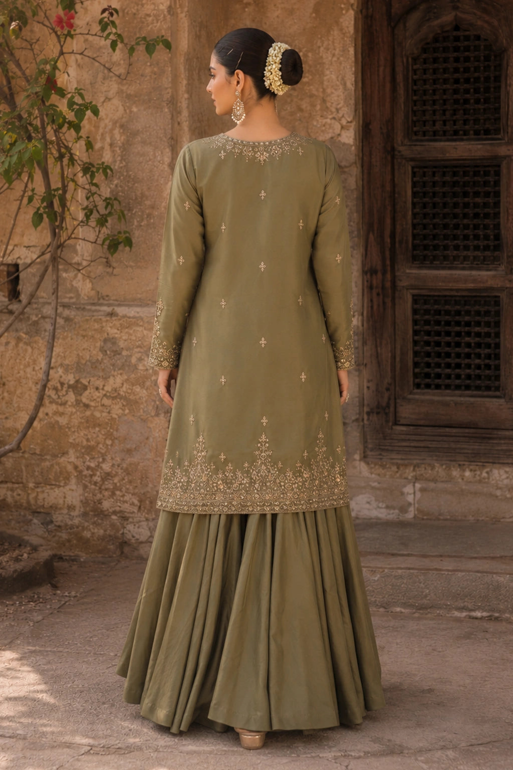 Aurevia Olive luxury olive green Korean silk formal dress featuring an embroidered straight shirt, flowing Korean silk lehenga, and embroidered organza dupatta by Miraam.