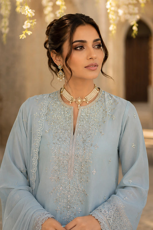 Azzurra Mist luxury powder blue Korean silk formal dress featuring an embroidered straight shirt, flowing chiffon sharara, and embroidered organza dupatta by Miraam.