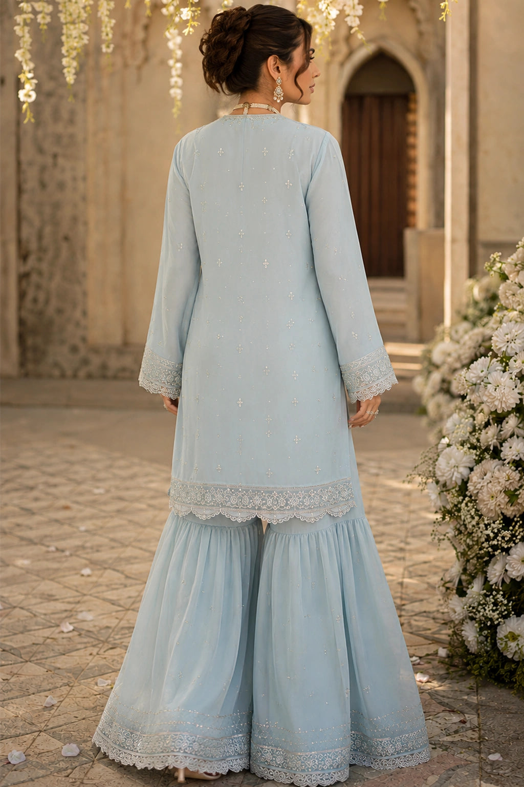 Azzurra Mist luxury powder blue Korean silk formal dress featuring an embroidered straight shirt, flowing chiffon sharara, and embroidered organza dupatta by Miraam.