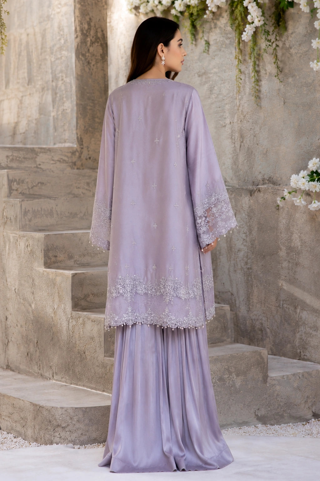 Lunaria Lilac luxury lilac Korean silk formal dress featuring an embroidered straight shirt, flowing sharara, and embroidered organza dupatta with pearl edging by Miraam.