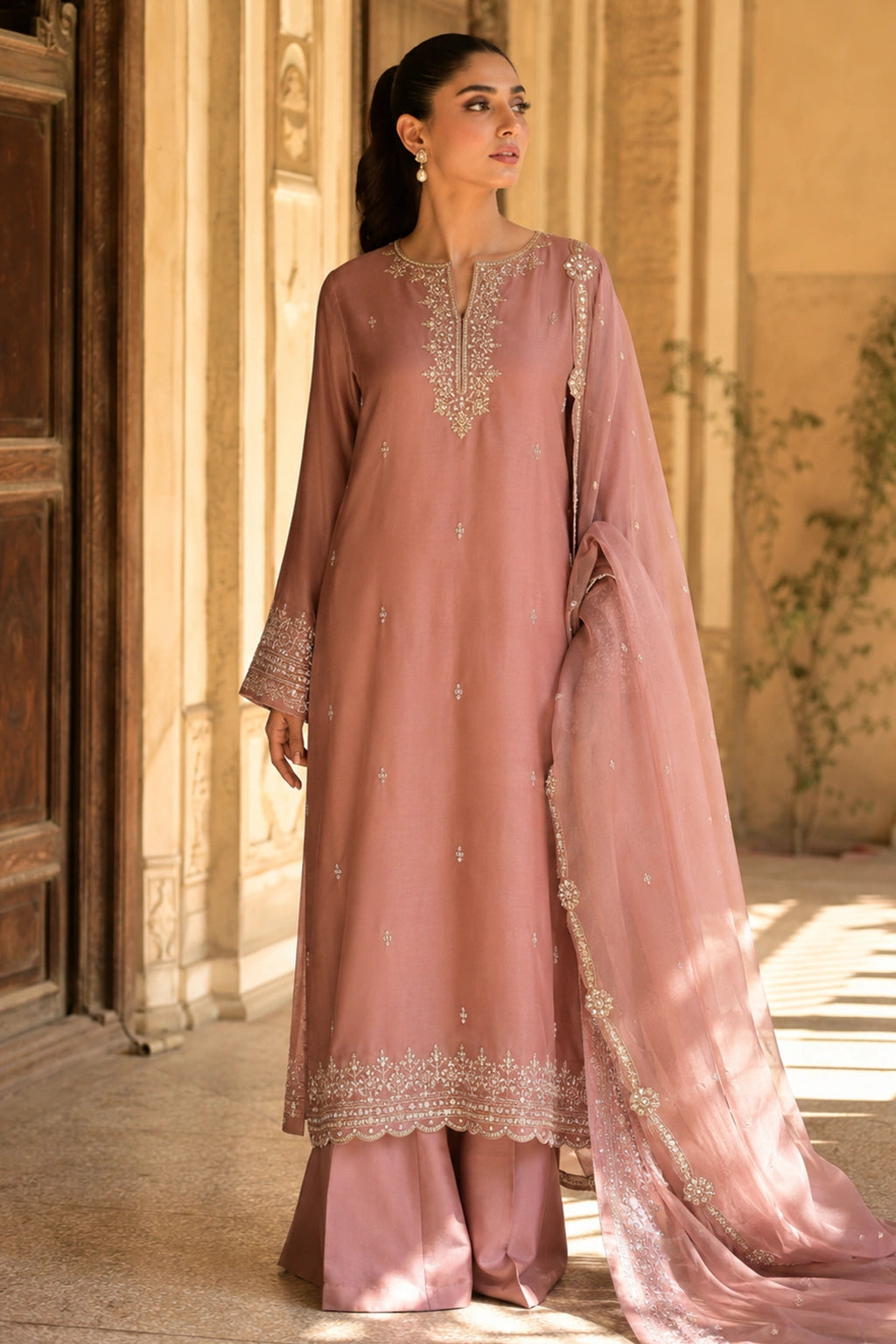 Roselune Blush luxury blush pink Korean silk formal dress featuring an embroidered straight shirt, flared trousers, and an embroidered organza dupatta by Miraam.