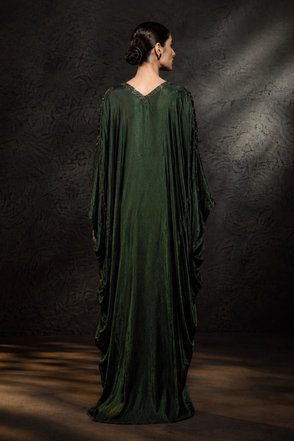 Emerald green sheesha silk kaftan with pleated drape detail by Miraam