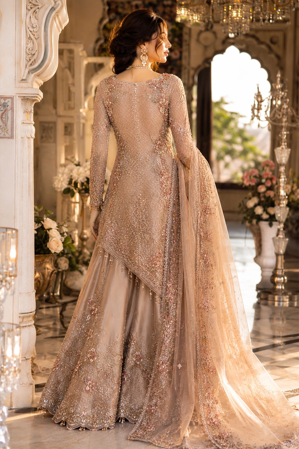 Woman wearing a blush beige Korean silk asymmetrical shirt with embellished sharara and embroidered organza dupatta by Miraam