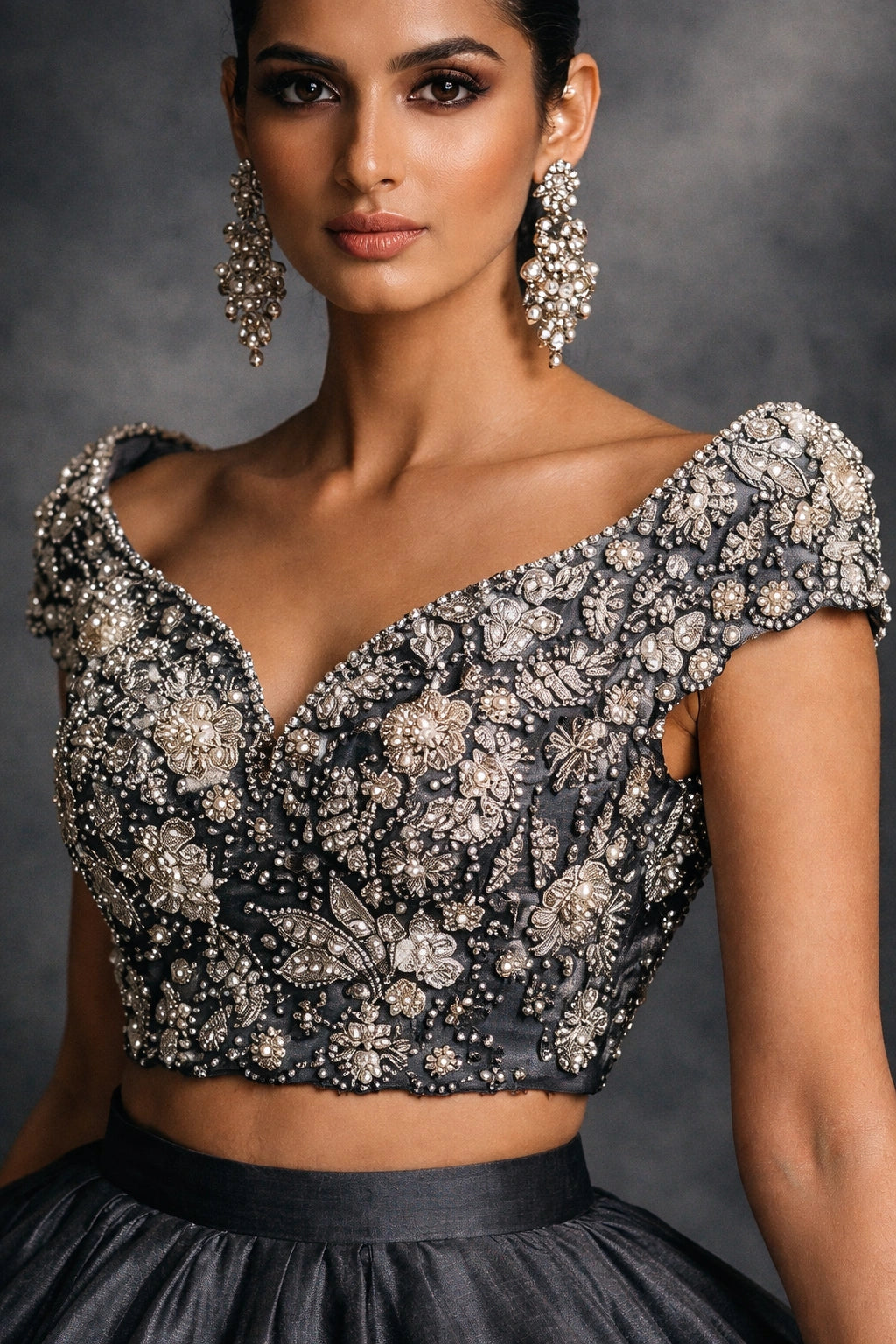 Charcoal formal lehenga with embellished blouse by Miraam, styled in a luxury studio editorial