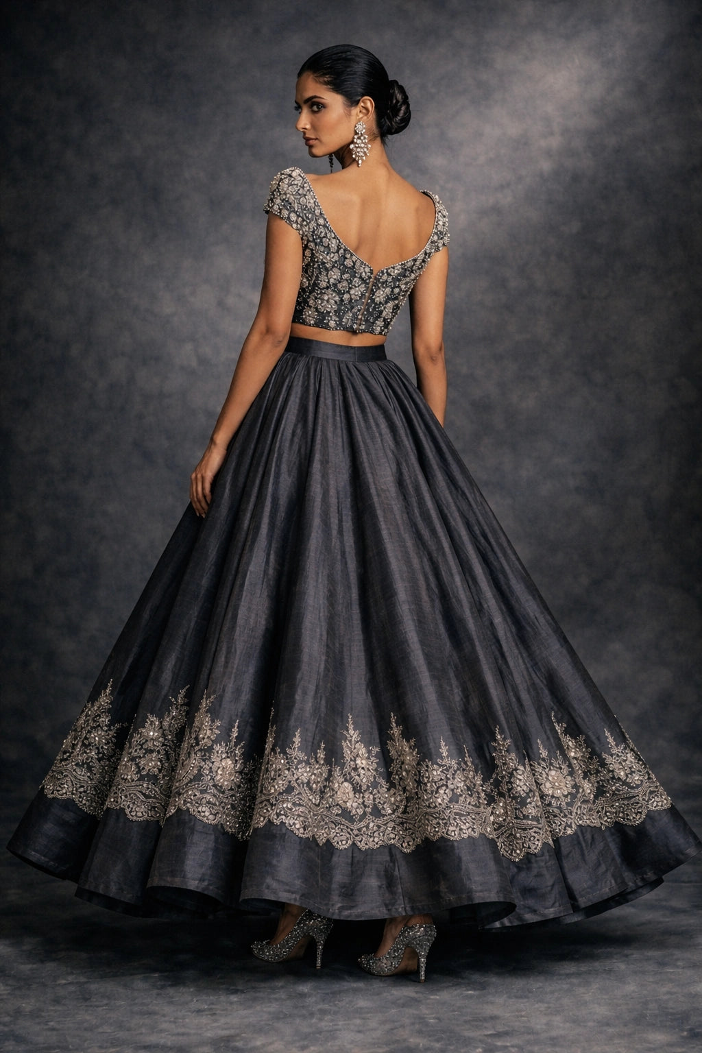 Charcoal formal lehenga with embellished blouse by Miraam, styled in a luxury studio editorial