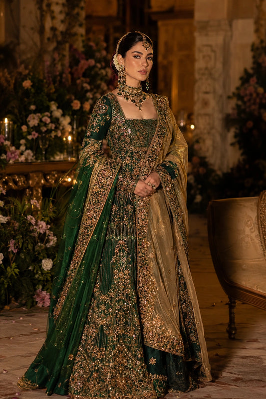 Model wearing an emerald green Korean silk bridal peplum lehenga with intricate gold embellishment and double-shade organza dupatta in a luxurious wedding setting by Miraam.