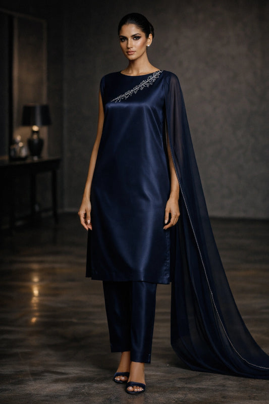Deep navy sheesha silk outfit with minimal diagonal hand-embellished neckline and sheer dupatta from Miraam’s Noor-e-Sheesha Collection