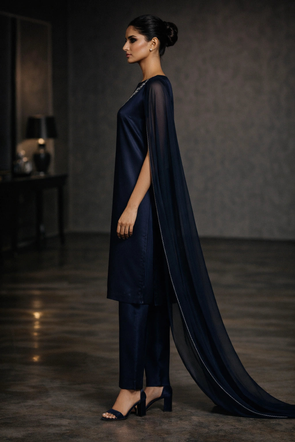 Deep navy sheesha silk outfit with minimal diagonal hand-embellished neckline and sheer dupatta from Miraam’s Noor-e-Sheesha Collection