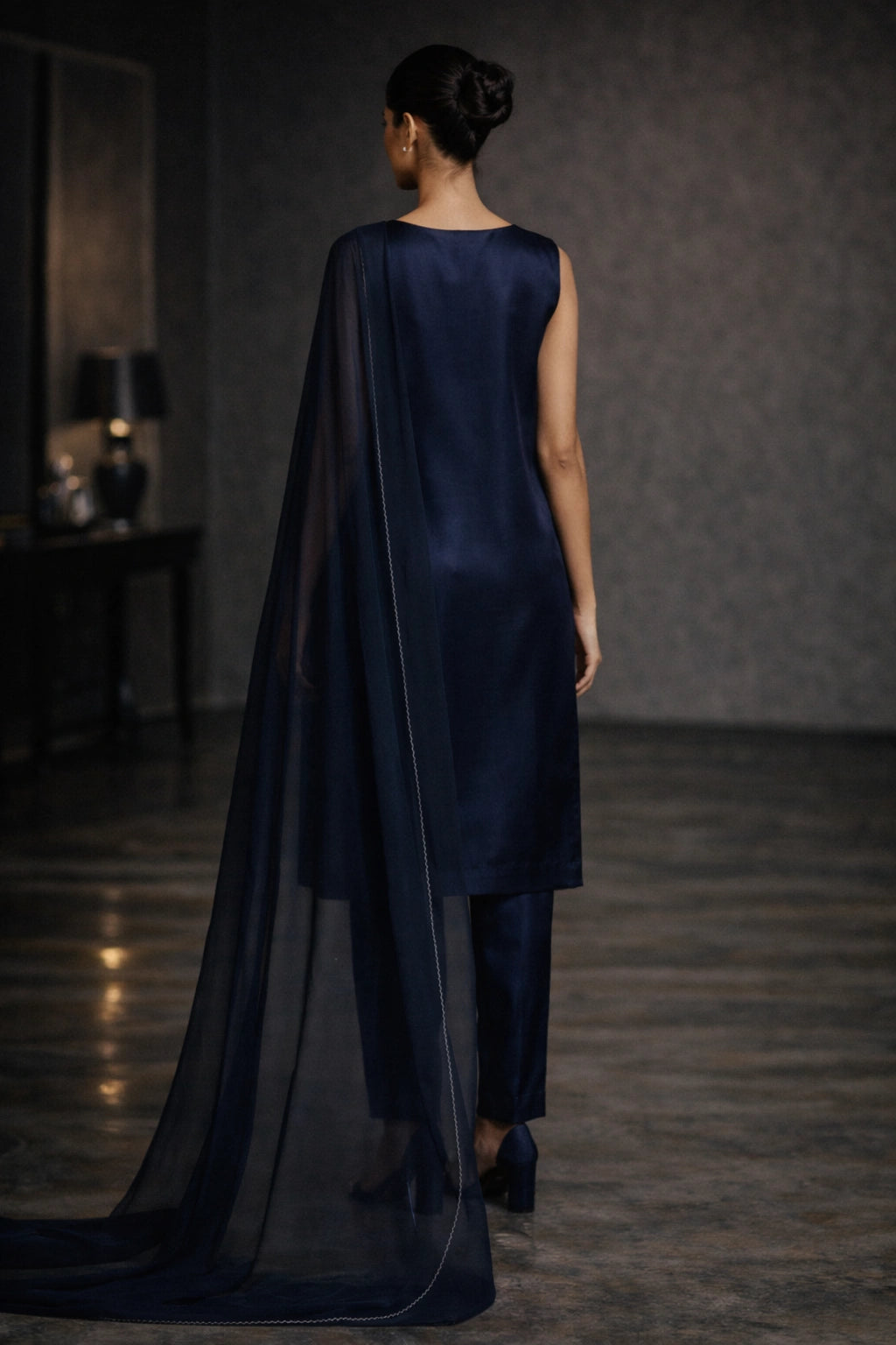 Deep navy sheesha silk outfit with minimal diagonal hand-embellished neckline and sheer dupatta from Miraam’s Noor-e-Sheesha Collection