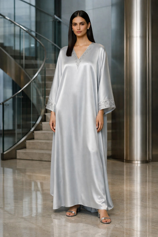 Silver silk kaftan with minimal embellishment, modern Pakistani luxury evening wear