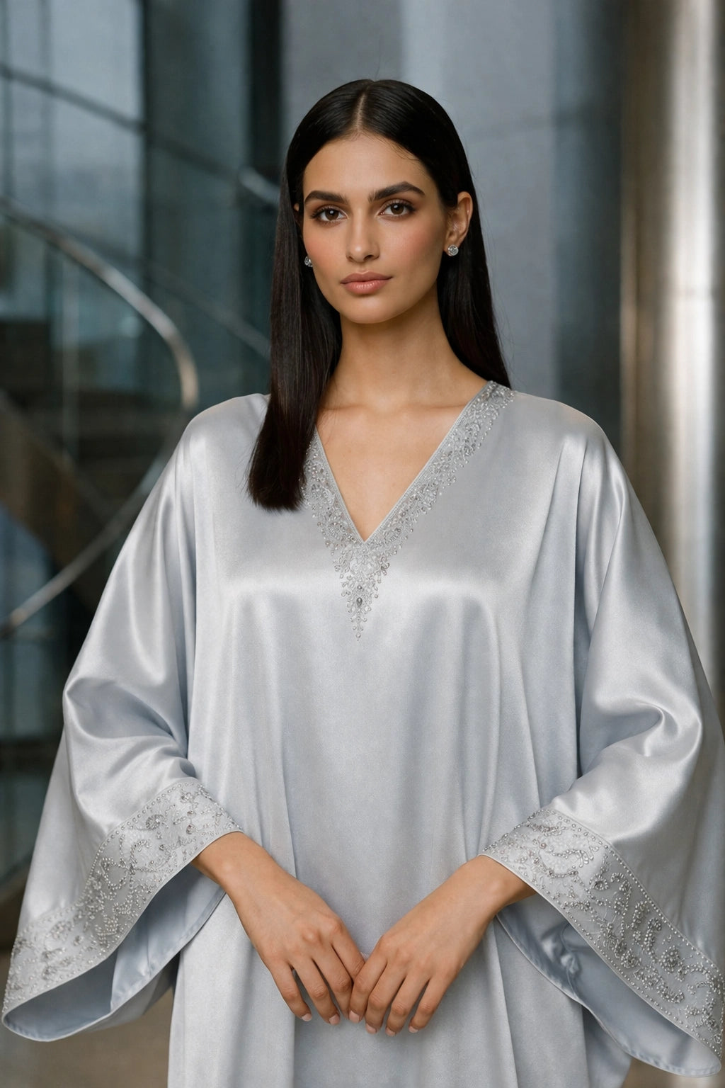 Silver silk kaftan with minimal embellishment, modern Pakistani luxury evening wear