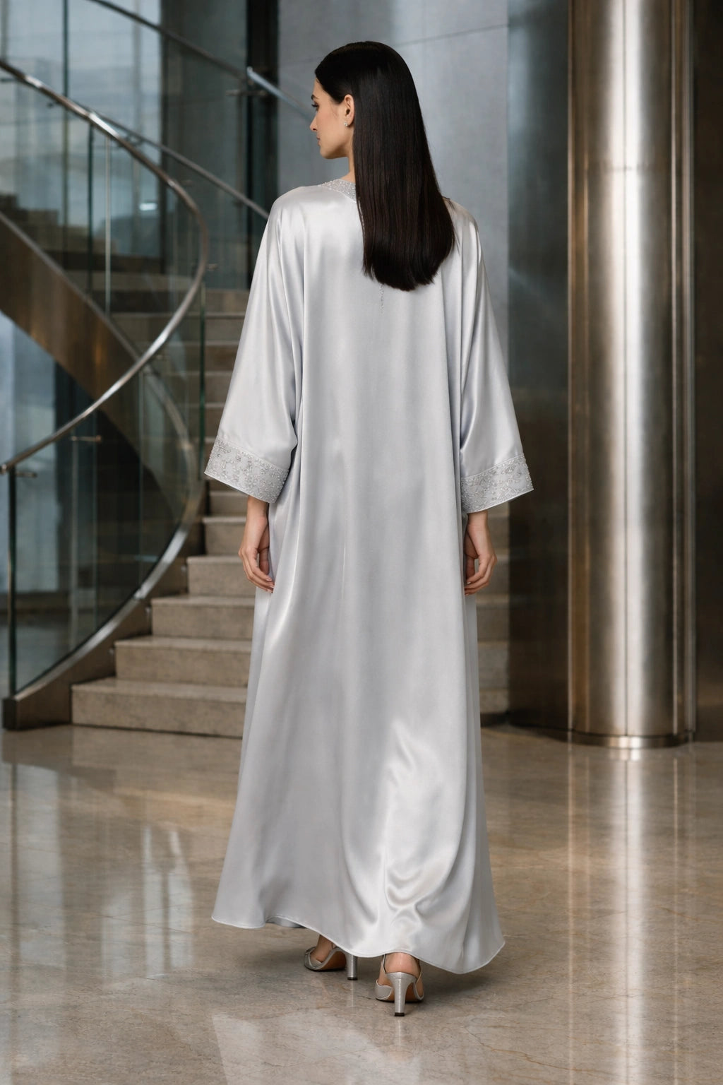 Silver silk kaftan with minimal embellishment, modern Pakistani luxury evening wear