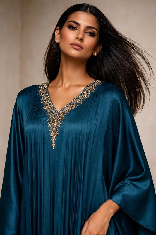 Teal silk pleated kaftan with embellished neckline, modern Pakistani luxury evening wear