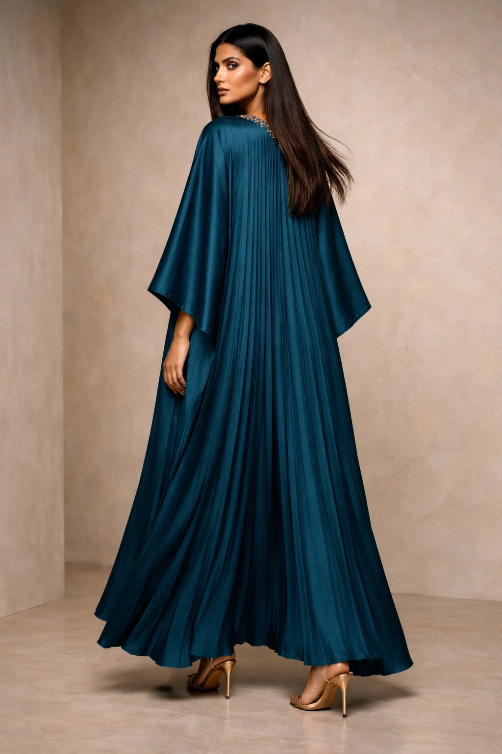Teal silk pleated kaftan with embellished neckline, modern Pakistani luxury evening wear