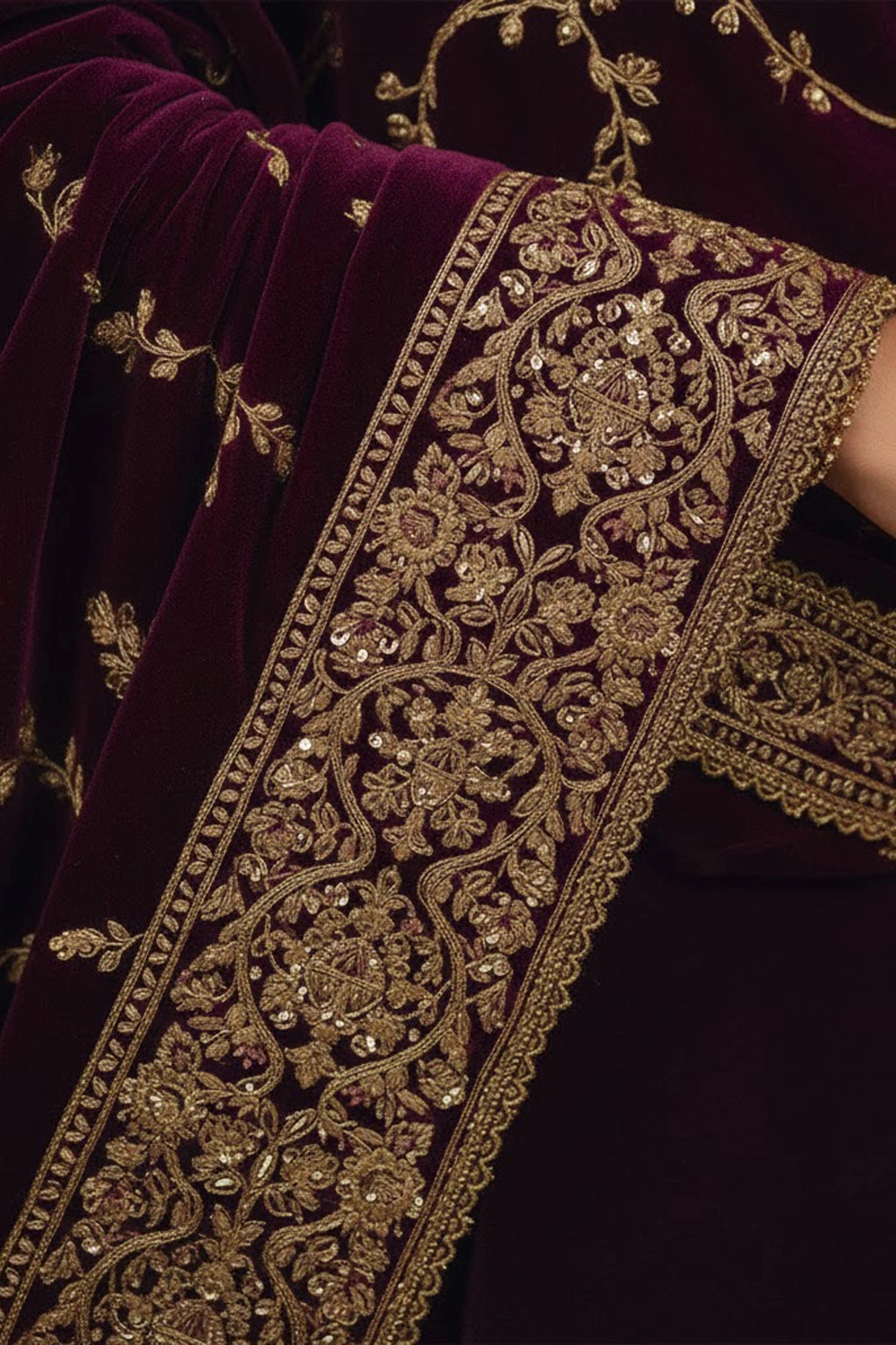 Plum velvet formal ensemble featuring delicate embroidered detailing and a richly embellished velvet dupatta by Miraam.